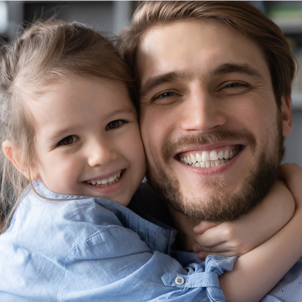 Dental Treatments Father & Daughter Smiling