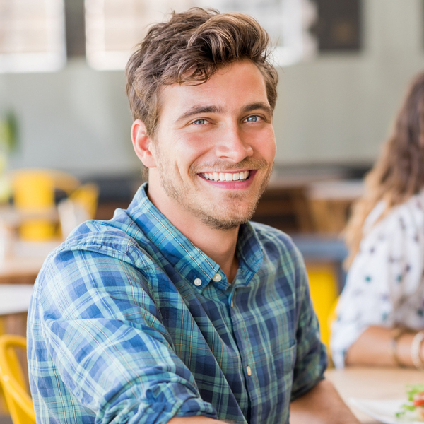 Fillings Young Man Smiling Sitting Down