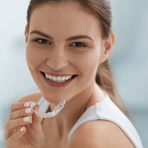 Invisalign Treatment Young Woman with Invisalign Clear Aligner