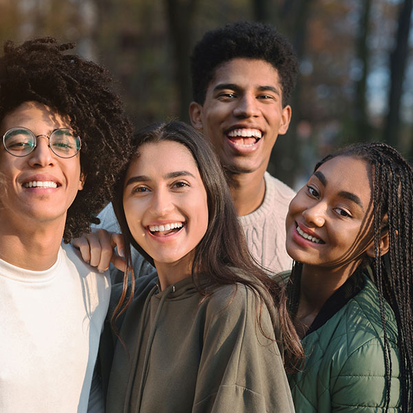 Technology Group of Young Adults Outdoors Near a Park